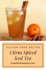 Pinterest mini image - Citrus and spice iced tea in a large glass next to cinnamon sticks and an orange