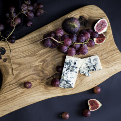 Fruit and blue cheese on a cutting board