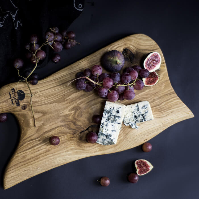 Fruit and blue cheese on a cutting board