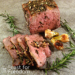 Roast beef garnished with rosemary