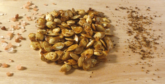 Roasted pumpkin seeds with sprinkled salt and spices