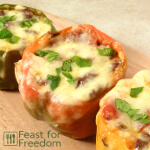 Red stuffed pepper on a cutting board