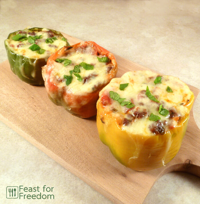 Stuffed peppers with a spicy ground beef filling and topped with melted cheese